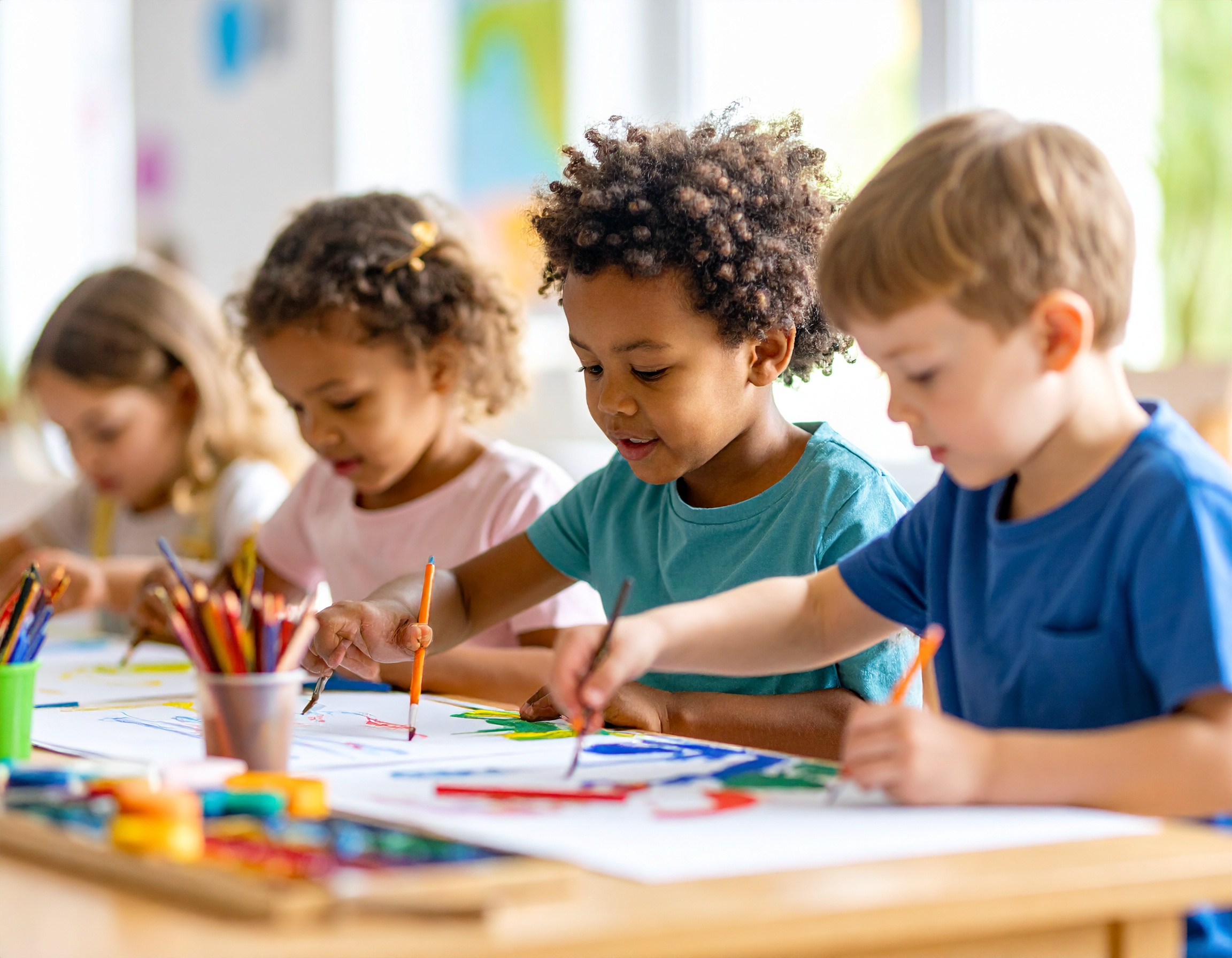 Preschool children reading a book